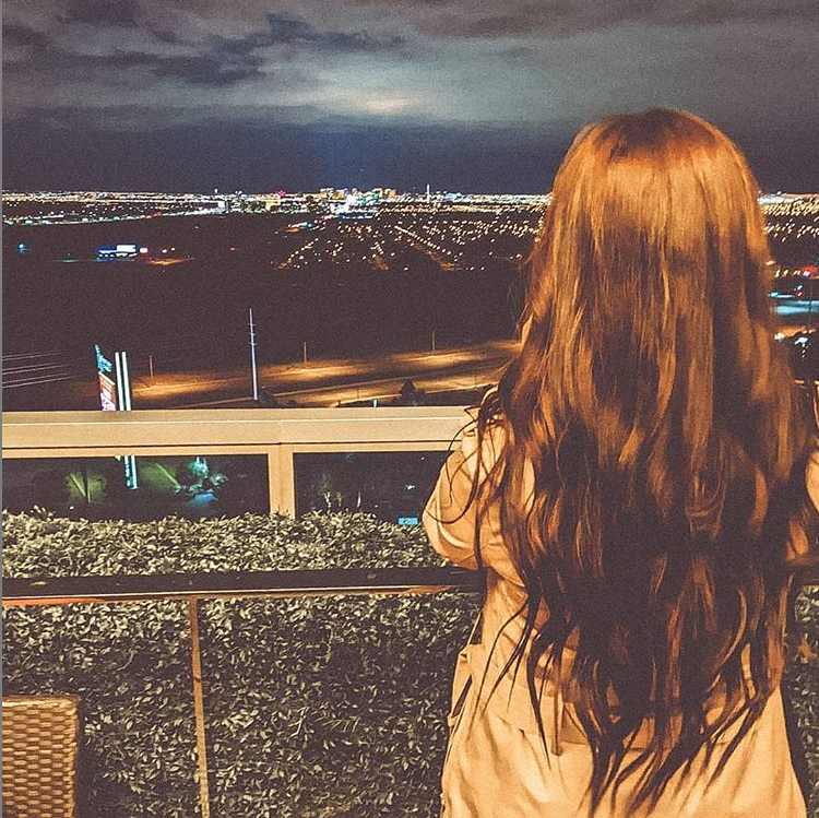 Woman Staring Over The Skyline of Las Vegas